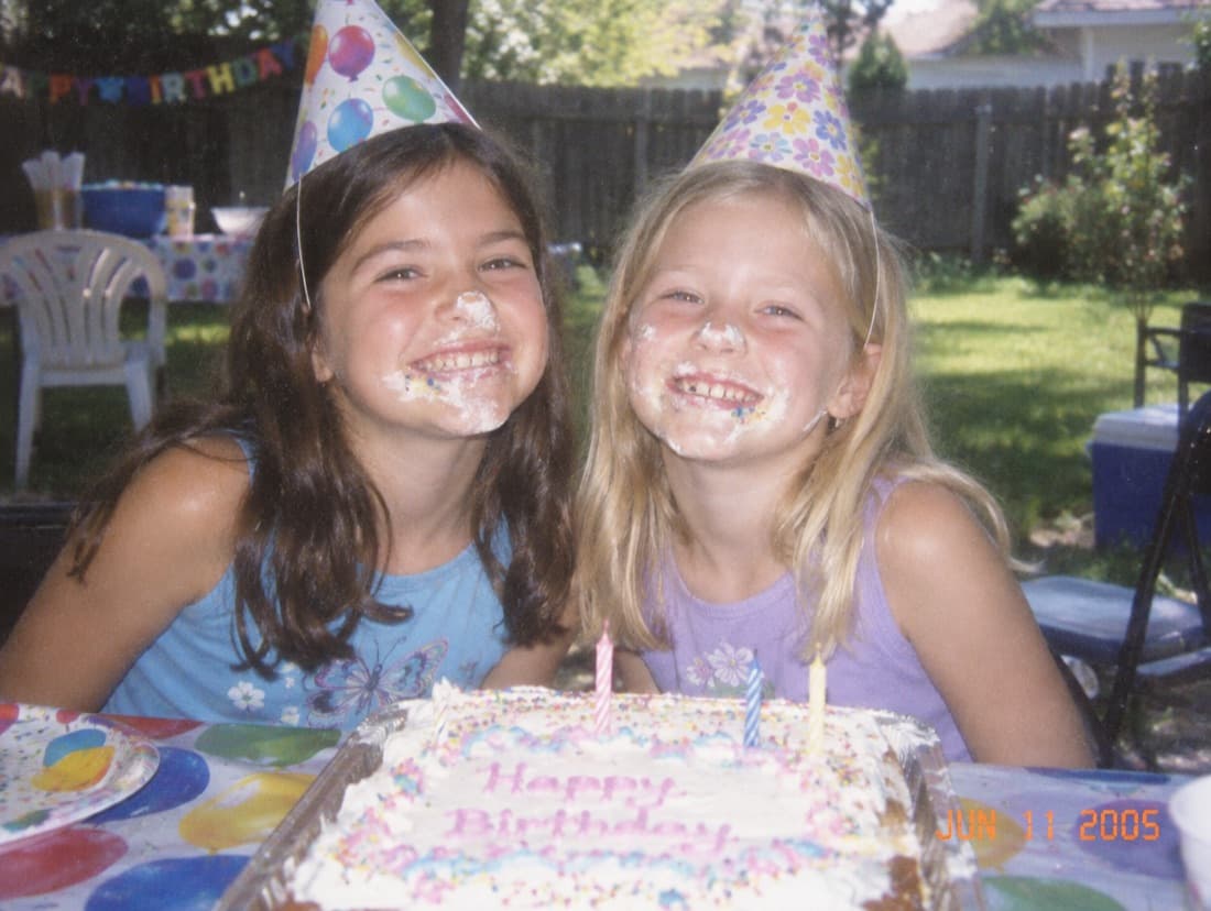 Maya and Lily at eight, frosting everywhere